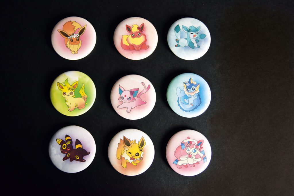 9 Badges évolution evoli, Aquali Voltali Électrik Pyroli Mentali Noctali Phyllali Givrali Nymphali